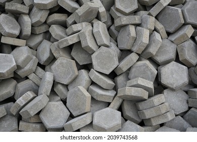 Pile Of Hexagon-shaped Paving Blocks That Will Be Used For Road Construction In Residential Areas.