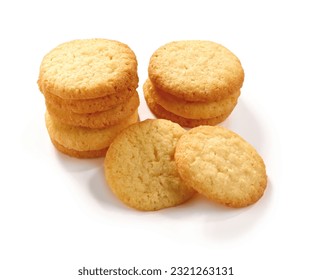 A pile of home made coconut cookies on a white background isolated with clipping path. - Shutterstock ID 2321263131