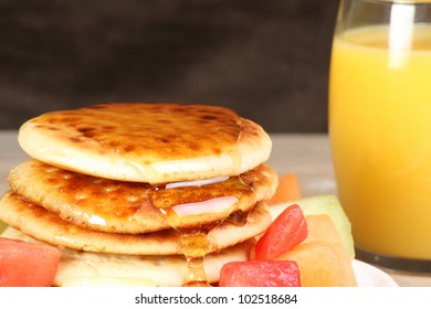 Pile Of Hot Scotch Pancakes With Honey And Melon