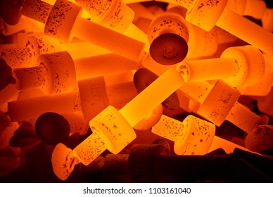 pile of hot steel parts - Shutterstock ID 1103161040