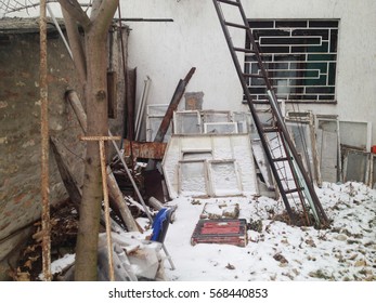 Pile Of Junk In Backyard Covered In Snow