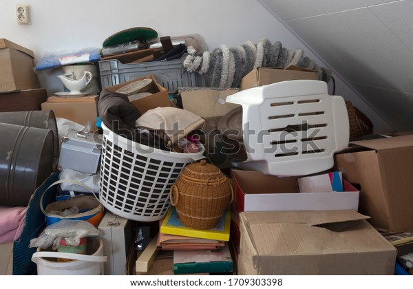 Pile of junk in a house, hoarder\
room pile of household equipment needs clearing out\
storage