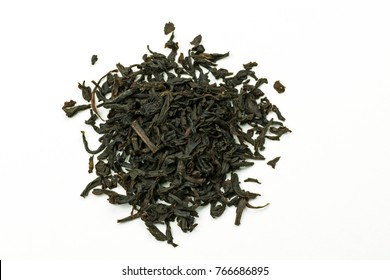 Pile of leaves quality black tea Earl Gray on white background