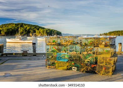 Pile of Lobster Pots on a Pier at Sunset
