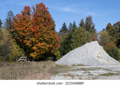 A Pile Of Loose Gravel With The Fall Colors