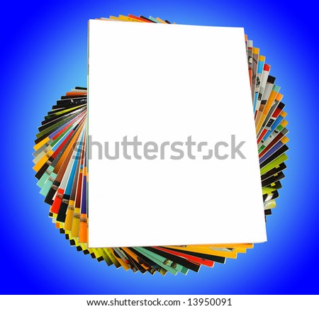 Pile of magazines isolated on blue background
