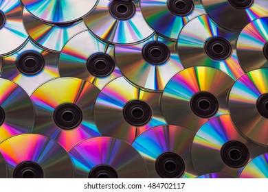 Pile Of Many CDs Or DVDs Background