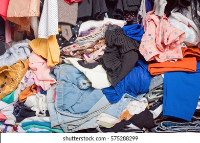 Pile Of Messy Clothes In Closet. Untidy Cluttered Woman.