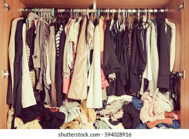 Pile Of Messy Clothes In Closet. Untidy Cluttered Woman Wardrobe In Vintage Style.