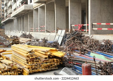 Pile Of Metal Pipeline Construction Materials, Iron Profiles, Steel Rods For Scaffolding On A Building Site. Renovation, Planning, Repair Modern Civil House. Concept Of Development Improvement Town