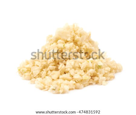Pile of minced garlic isolated over the white background