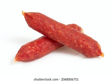 Pile of mini smoked sausages isolated on whit