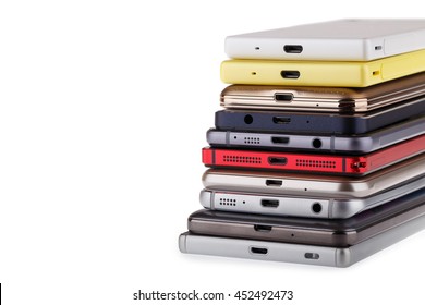 Pile Of Mobile Phone. Heap Of The Different Smartphones Isolated On White Background.