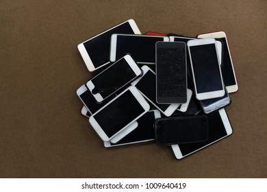 Pile Of Mobile Phone.
Smartphones Technology Concept Background. 