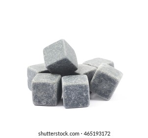 Pile of multiple whiskey cooling stone cubes composition isolated over the white background