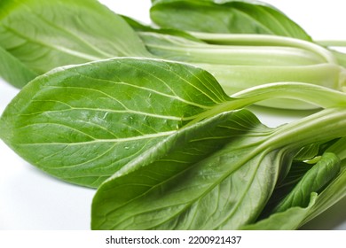 A Pile Of Mustard Greens On White Background