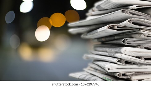 Pile of newspapers on blur background - Shutterstock ID 1596297748