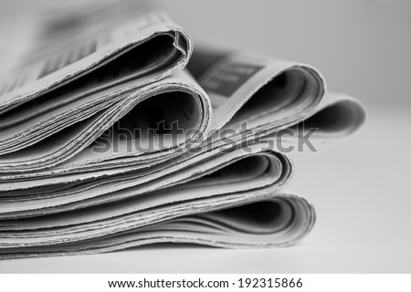 Pile of newspapers, processed in black and white