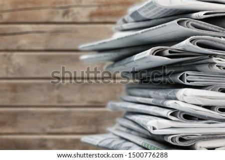 Pile of newspapers stack on background