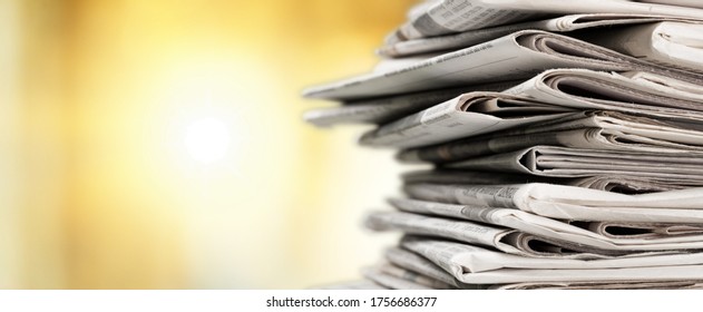 Pile of newspapers stacks on blur background - Shutterstock ID 1756686377