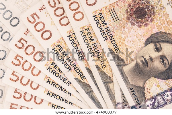 Pile of Norwegian Krone. Norwegian Currency\
Financial Background.