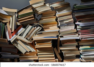 Pile Of Old Books In Dramatic Dim Light In The Attic