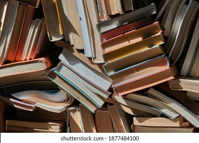 Pile Of Old Books In Dramatic Window Light In The Attic