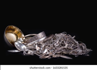 Pile Of Old And Broken Scrap Silver Metal Jewellery On Extended Black Background