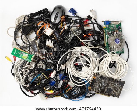 Pile of old cables and computer components on a white background.