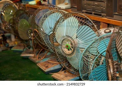 Pile of old rusty electric fans