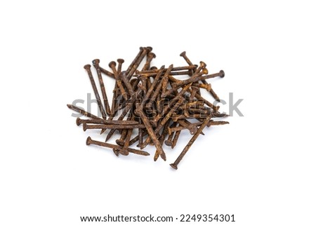 a pile of old rusty nails isolated on white background.