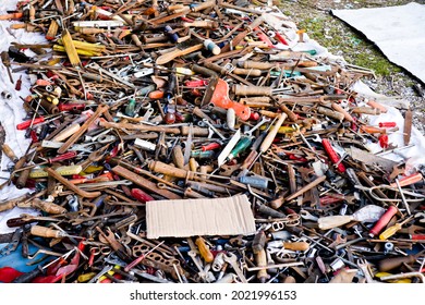 pile of old rusty tools at the flea market, hand work tools, street sale  of screwdrivers, pliers, wrenches. Set of mechanical tools for manual work