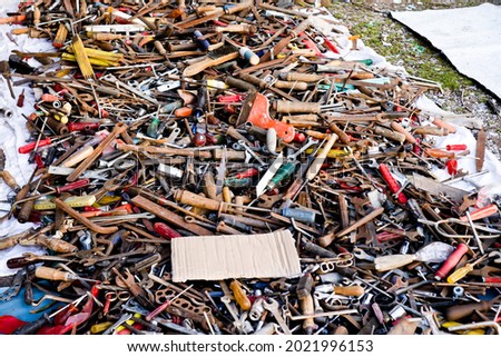 pile of old rusty tools at the flea market, hand work tools, street sale  of screwdrivers, pliers, wrenches. Set of mechanical tools for manual work