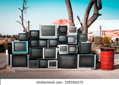 Pile Of Old Televisions Displayed Along The Road