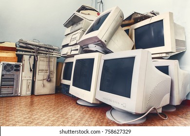 pile of old unused computers and vintage CRT monitors
 - Shutterstock ID 758627329