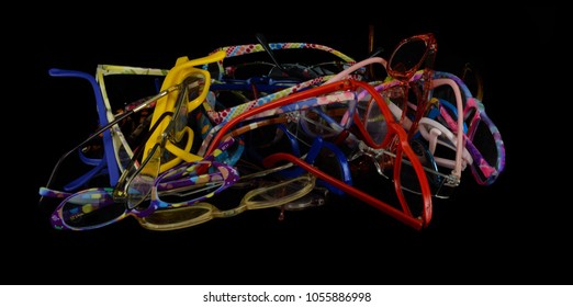 A Pile Of Old Used And Broken Reading Glasses