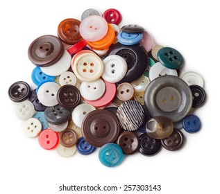 Pile Of Old And Used Clothes Buttons Isolated On White Background