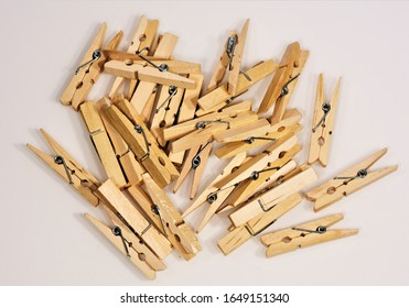 Pile Of Old Wooden Clothe Pins Are Used To Hang Clothes Outside On A Line To Dry. 