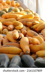 Pile Of Orange Banana Squash At A Market