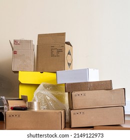 A Pile Of Packing Box On The Desk In The Dispatch Office