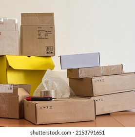 A Pile Of Packing Box On The Desk In The Dispatch Office. Copy Space.