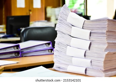 A Pile Of Paper, An Important, Unfinished Work, Was Piled Up On A Desk In An Office, Soft And Selective Focus.