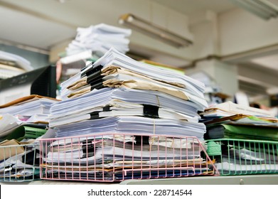 Pile Of Papers On The Desk