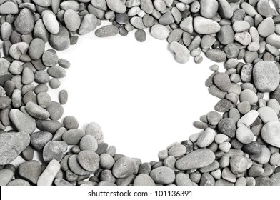 a pile of pebbles forming a frame with a blank space
