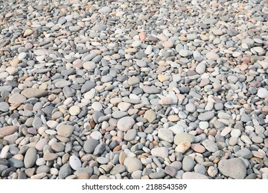 Pile Of Pebbles On Shingle Beach As Background