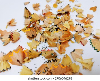 Pile of pencil waste and dust on a white paper - Shutterstock ID 1706046298