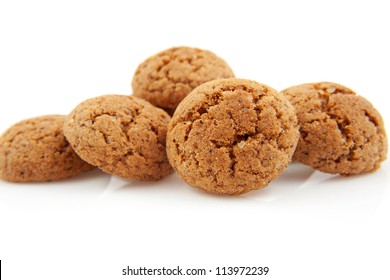 Pile Of Pepernoten, Typical Dutch Cookies In December Over White Background