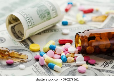 Pile Of Pharmaceutical Drug And Medicine Pills On Dollar Money, Cost Of Healthcare And Medical Insurance Concept