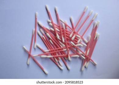 Pile Of Pink Cotton Buds On A White Background