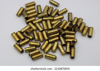 A Pile Of Pistol Cartridges With Rubber Bullets